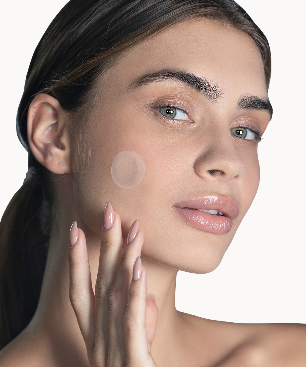 ENLIGHTEN microneedle patch applie on woman's face
